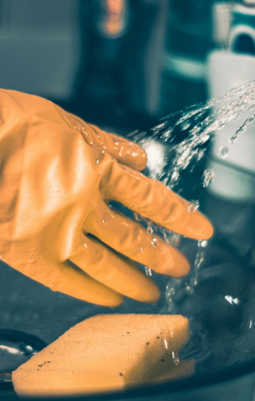 person-in-yellow-shirt-pouring-water-on-clear-glass.jpg person in yellow shirt pouring water on clear glass